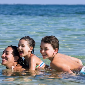 Family Swimming in Ocean in Los Cabos