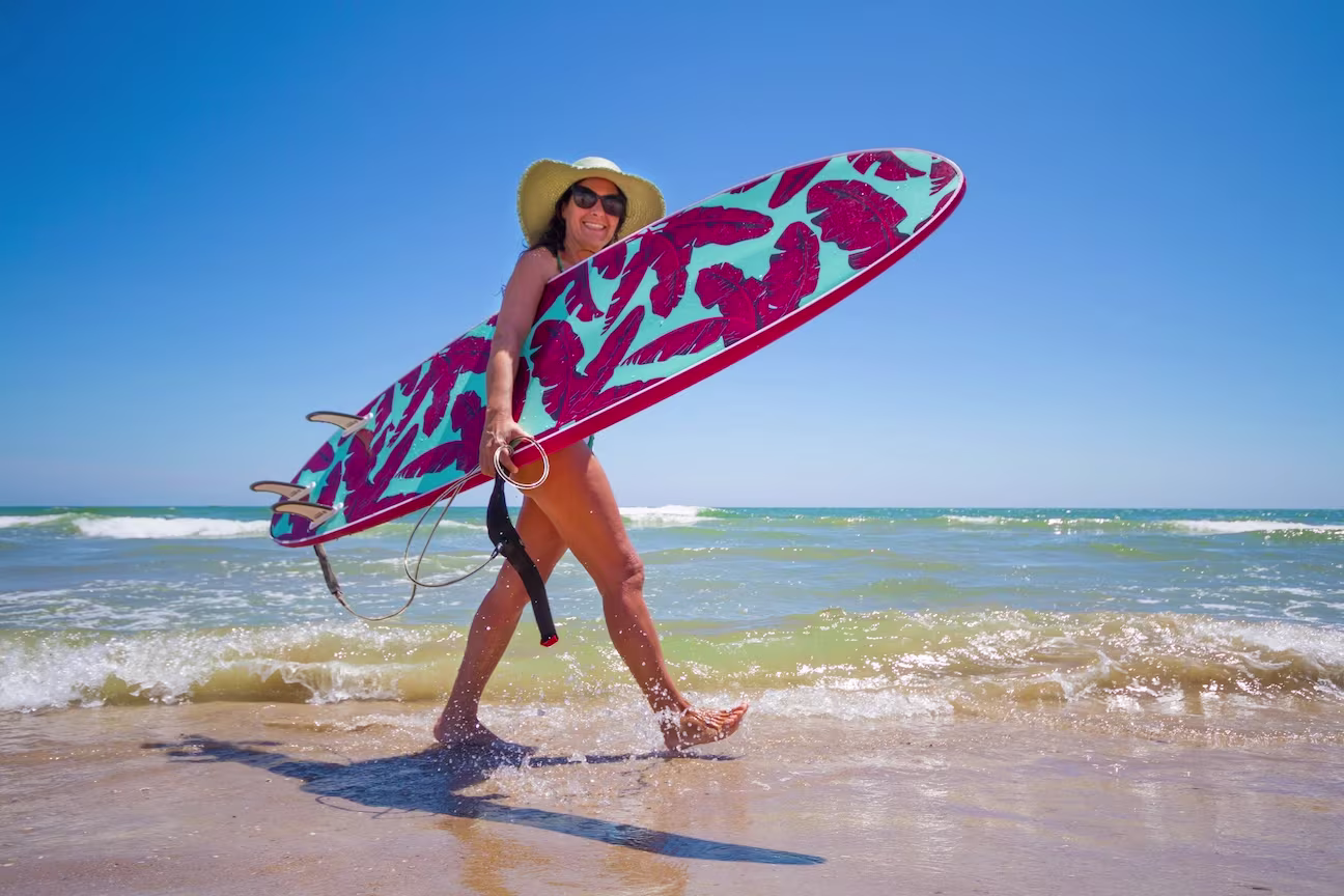 Women Holding Paddleboard on Los Cabos Beach