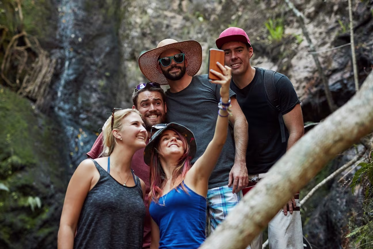 Tourists Taking Pictures with Local Guide in Los Cabos