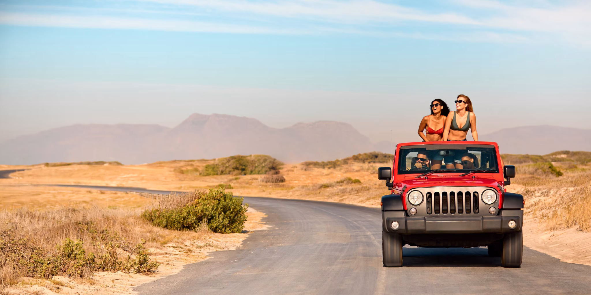 Girls On Top of Rental Car in Los Cabos Desert