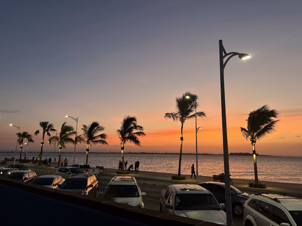 La Paz Malecon at Sunset with Transportation Vehicles